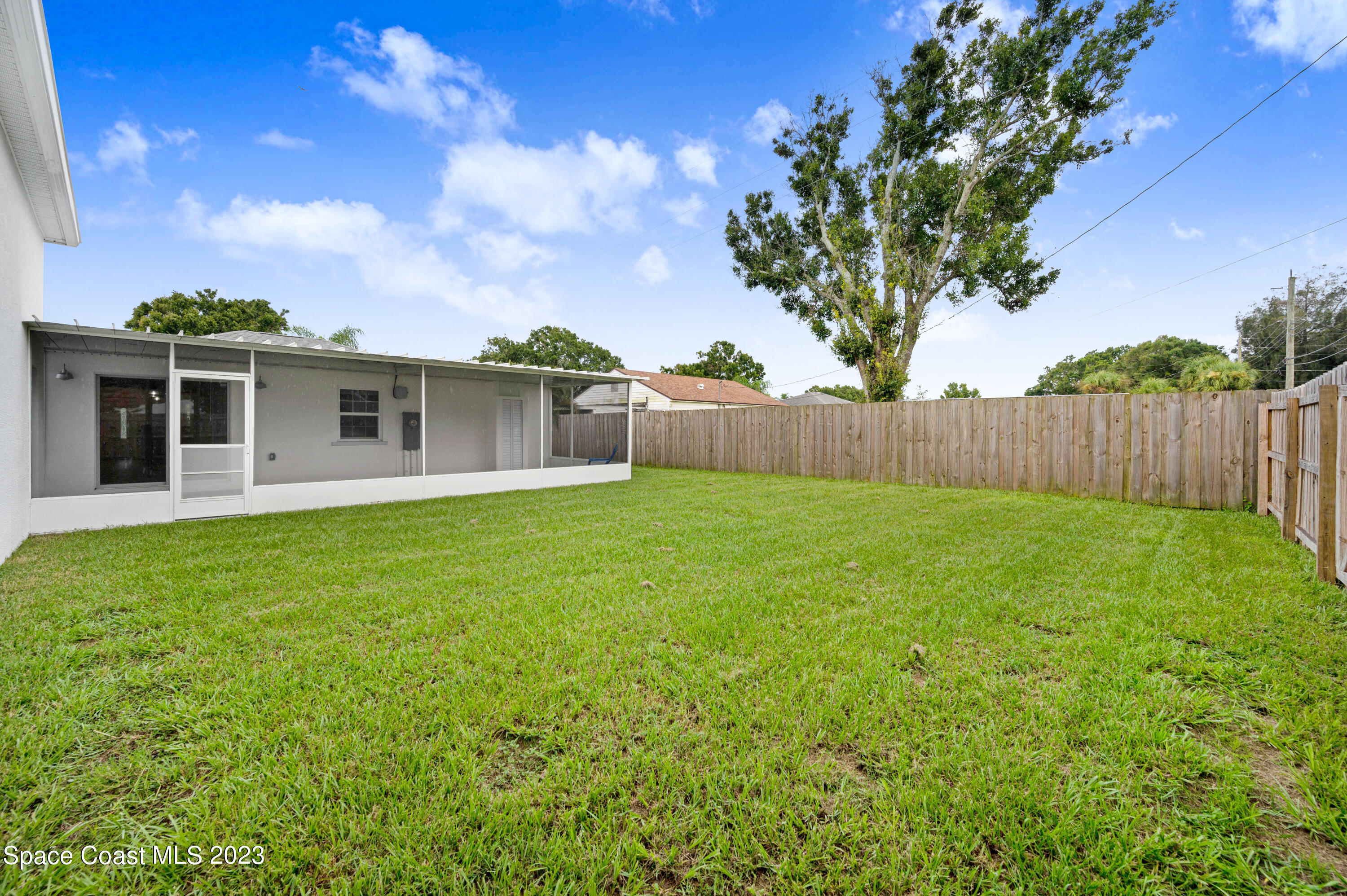 1720 Elizabeth Street Melbourne, FL 32901 - Photo 27 of 33 a view of a house with backyard and a tree