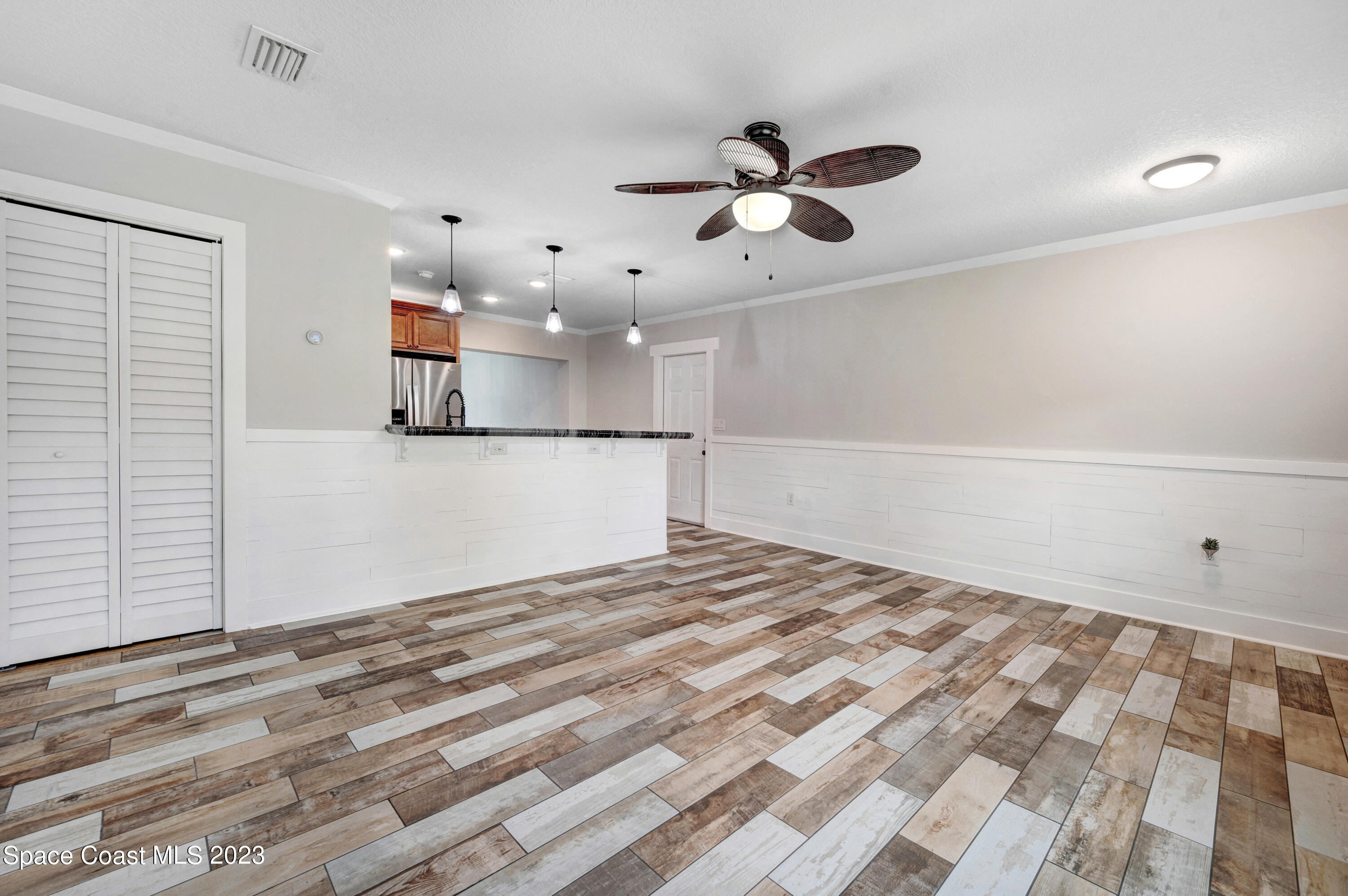1720 Elizabeth Street Melbourne, FL 32901 - Photo 8 of 33 a view of a livingroom with a ceiling fan and window