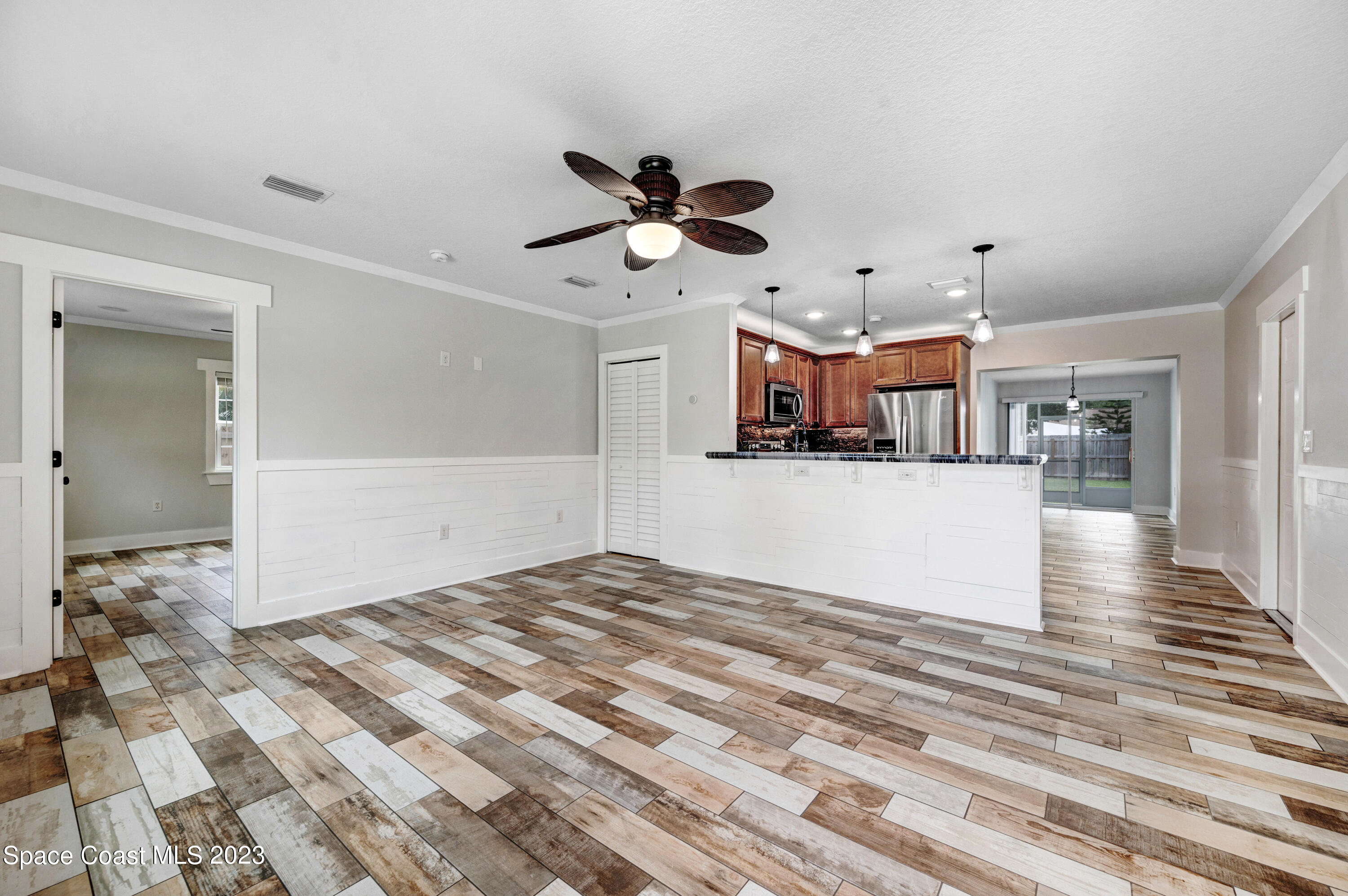1720 Elizabeth Street Melbourne, FL 32901 - Photo 9 of 33 a view of a kitchen and a window a ceiling fan