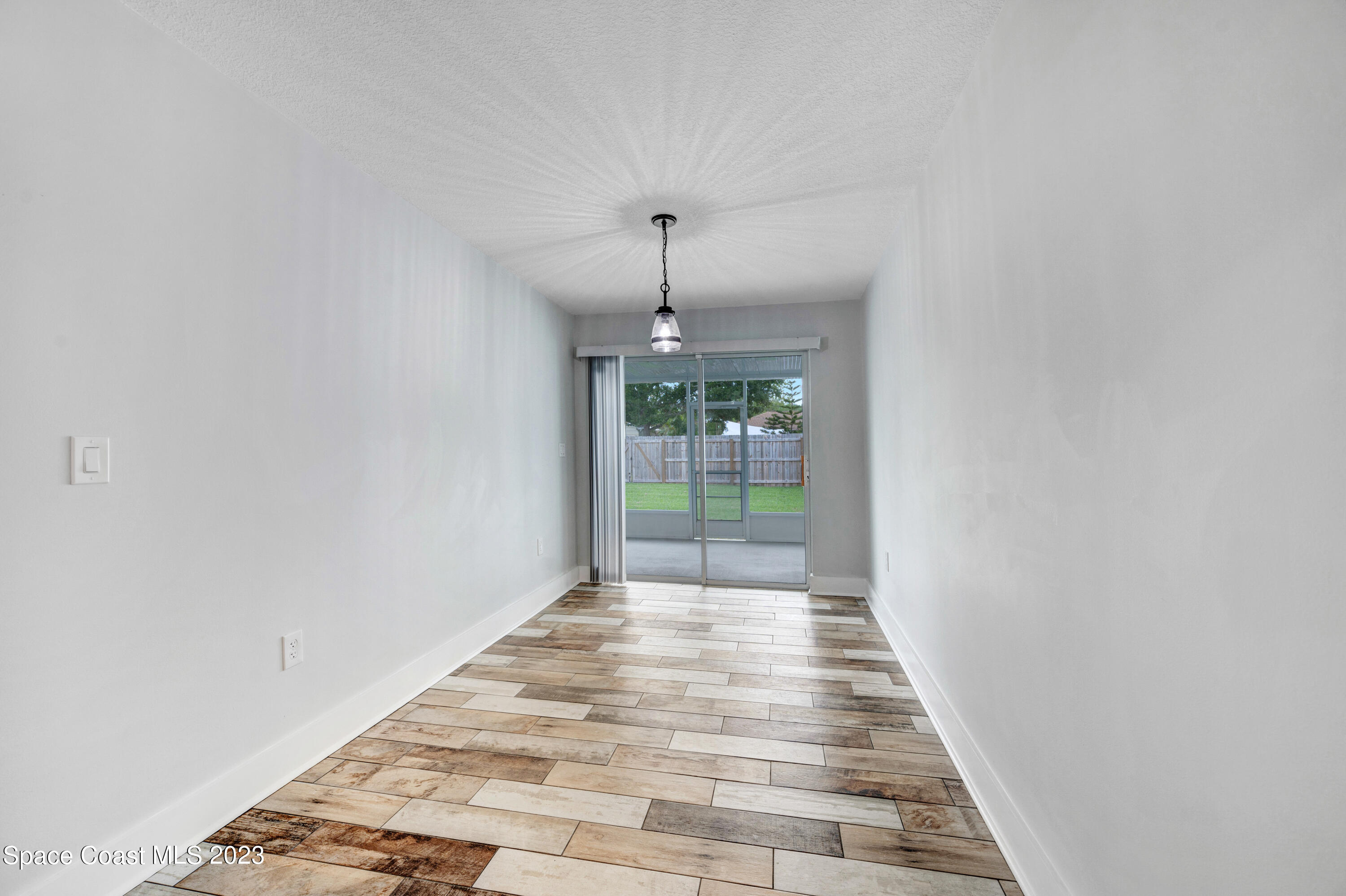 1720 Elizabeth Street Melbourne, FL 32901 - Photo 10 of 33 a hallway with wooden floor and a carpet