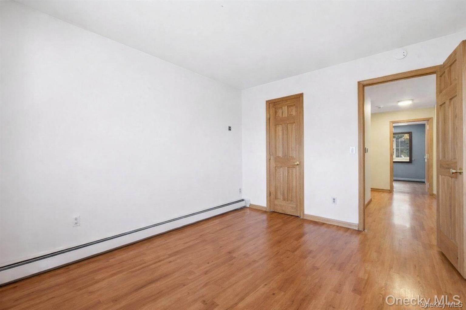 63 Farview Road Carmel, NY 10512 - Photo 22 of 38 an empty room with wooden floor and closet