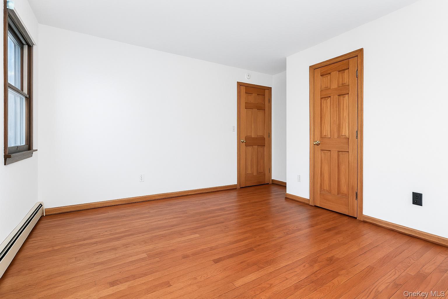 63 Farview Road Carmel, NY 10512 - Photo 25 of 38 an empty room with wooden floor and closet