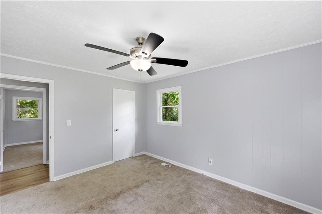 300 Cash Town Road Aragon, GA 30104 - Photo 19 of 28 an empty room with a window and a fan