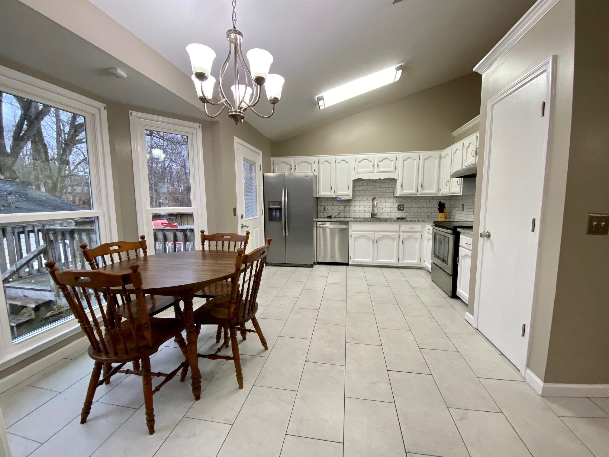 350 State Street Cookeville, TN 38501 - Photo 2 of 21 a kitchen with stainless steel appliances granite countertop a dining table chairs and granite counter tops