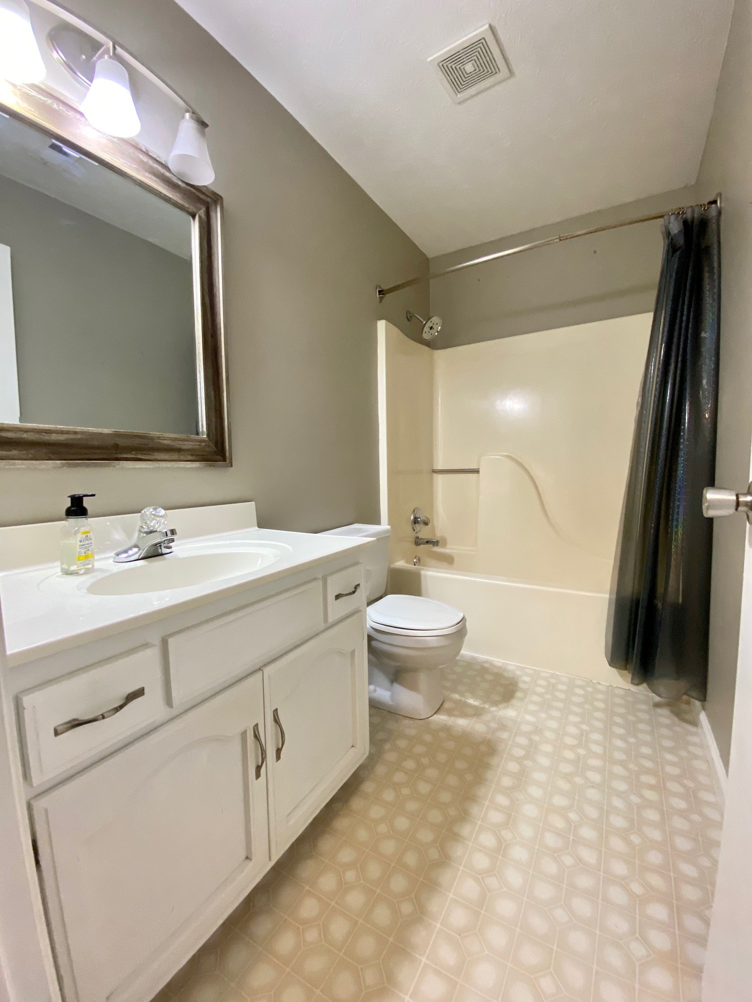 350 State Street Cookeville, TN 38501 - Photo 13 of 21 a bathroom with a double vanity sink a toilet and a mirror