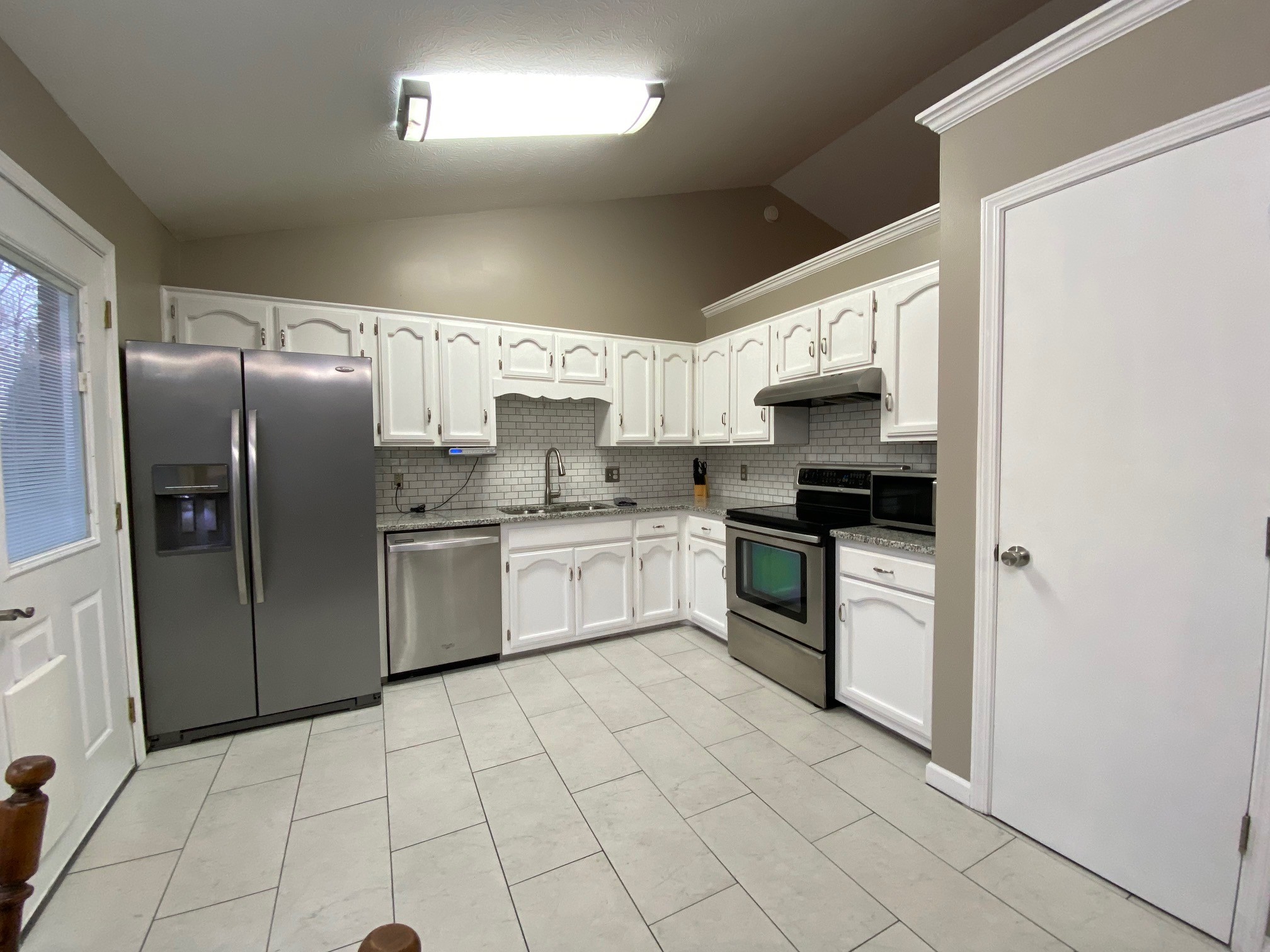 350 State Street Cookeville, TN 38501 - Photo 3 of 21 a kitchen with stainless steel appliances a refrigerator sink and microwave