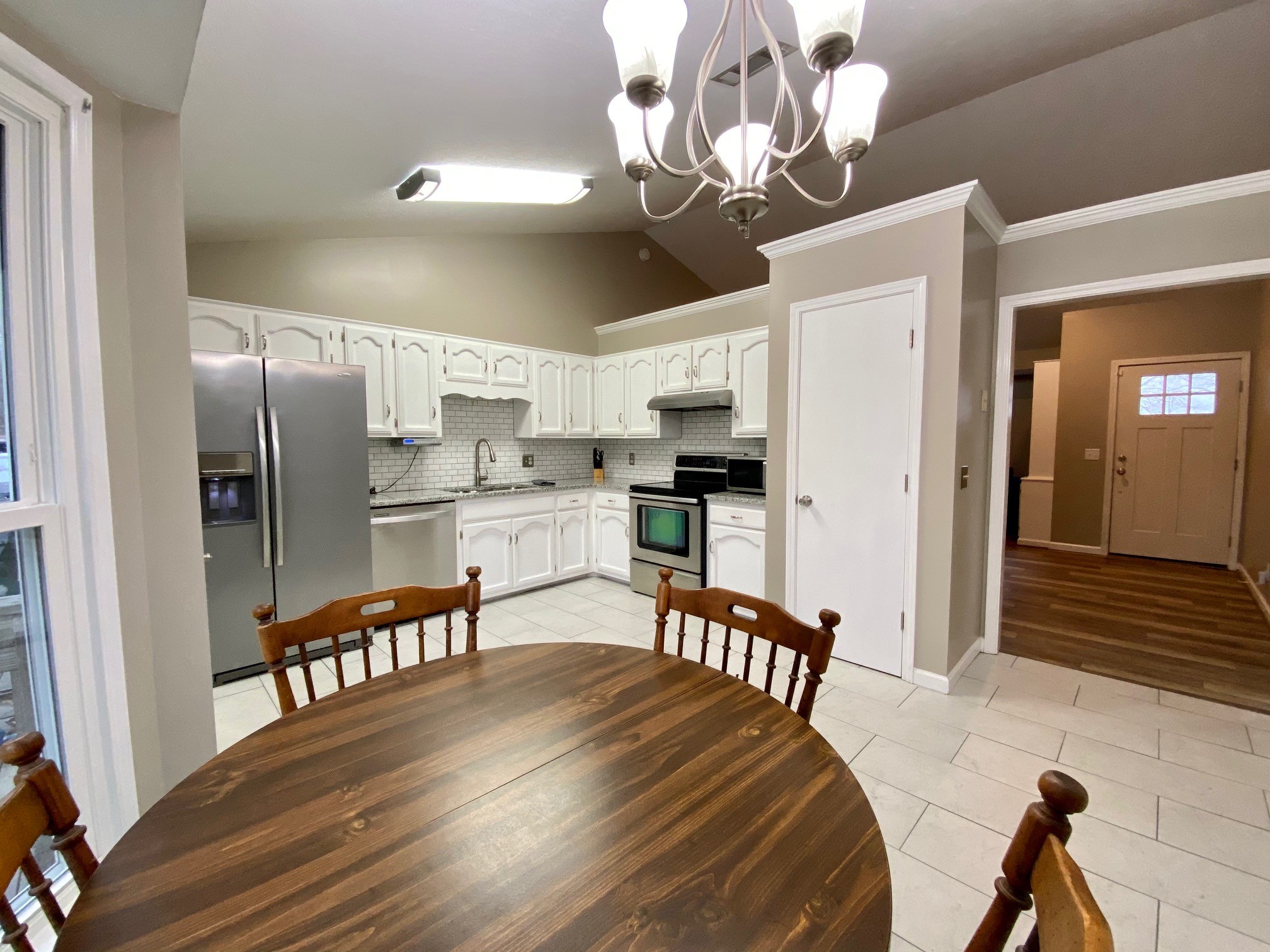 350 State Street Cookeville, TN 38501 - Photo 6 of 21 a kitchen with stainless steel appliances granite countertop a dining table chairs and granite counter tops