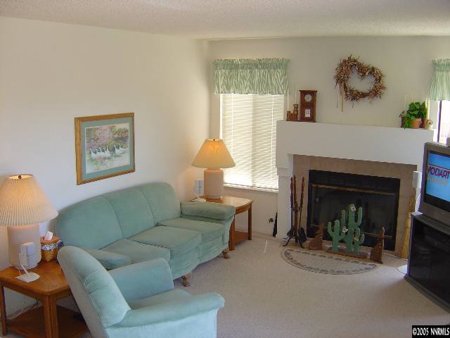 1797 Fox Run Road Reno, NV 89523 - Photo 4 of 9 a living room with furniture and a fireplace
