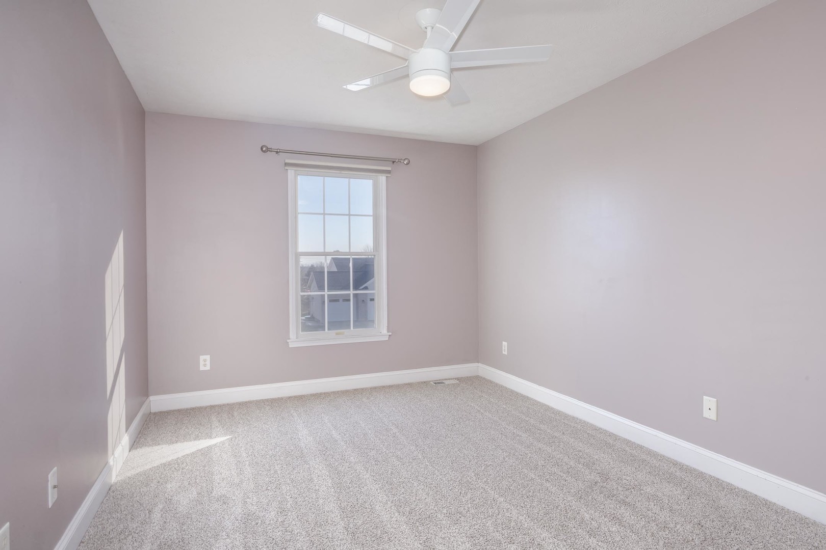 2409 Sanford Lane Normal, IL 61761 - Photo 31 of 62 an empty room with a window and chandelier fan