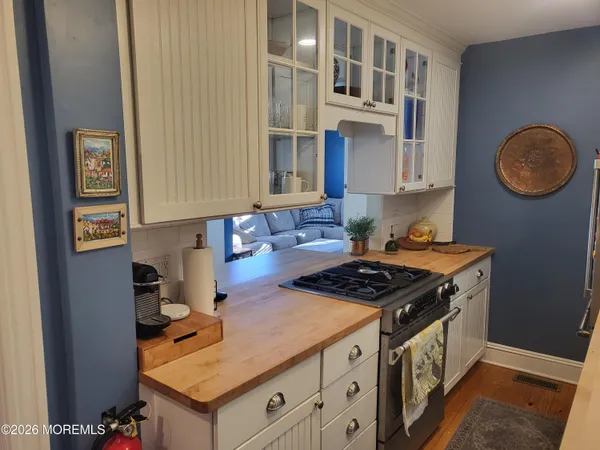 a kitchen with stainless steel appliances granite countertop a stove and a sink