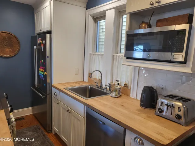 a kitchen with a stove and a microwave