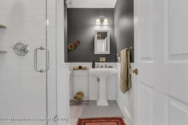 a bathroom with a sink and mirror
