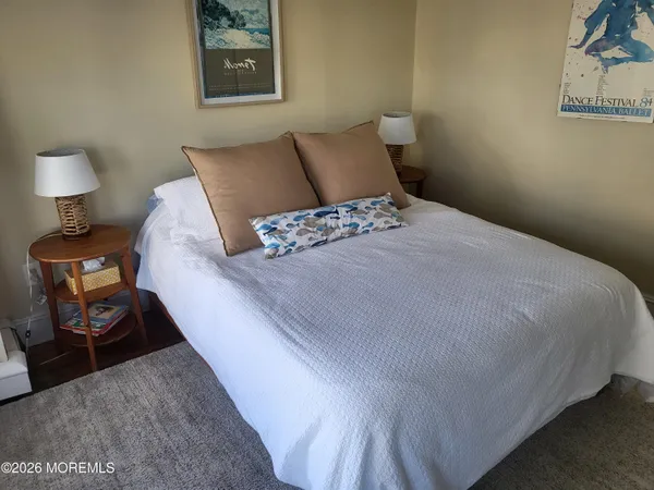 a bedroom with a bed and night stand