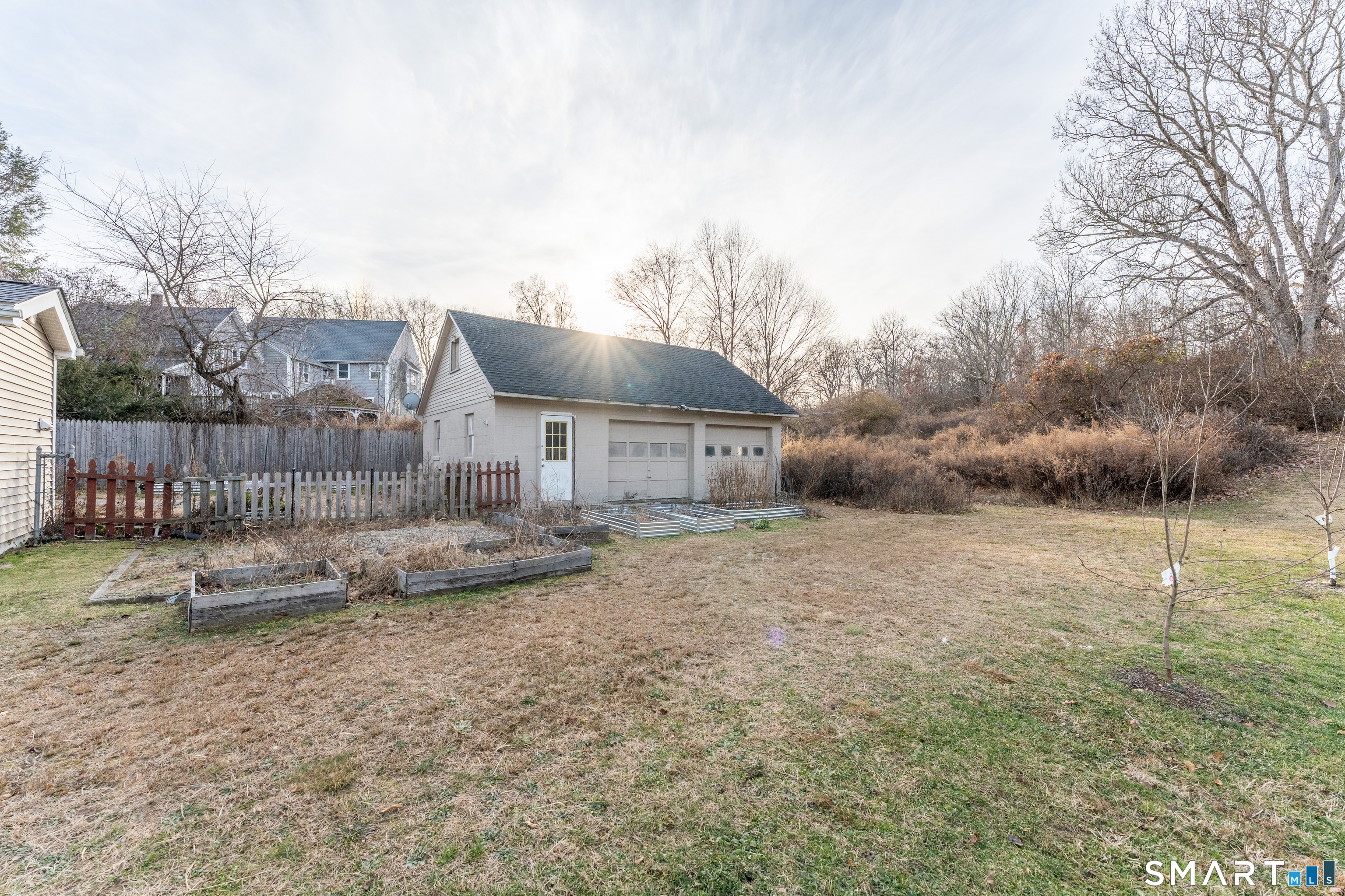 92 Hunters Avenue Norwich, CT 06380 - Photo 14 of 36 a backyard of house with table and chairs