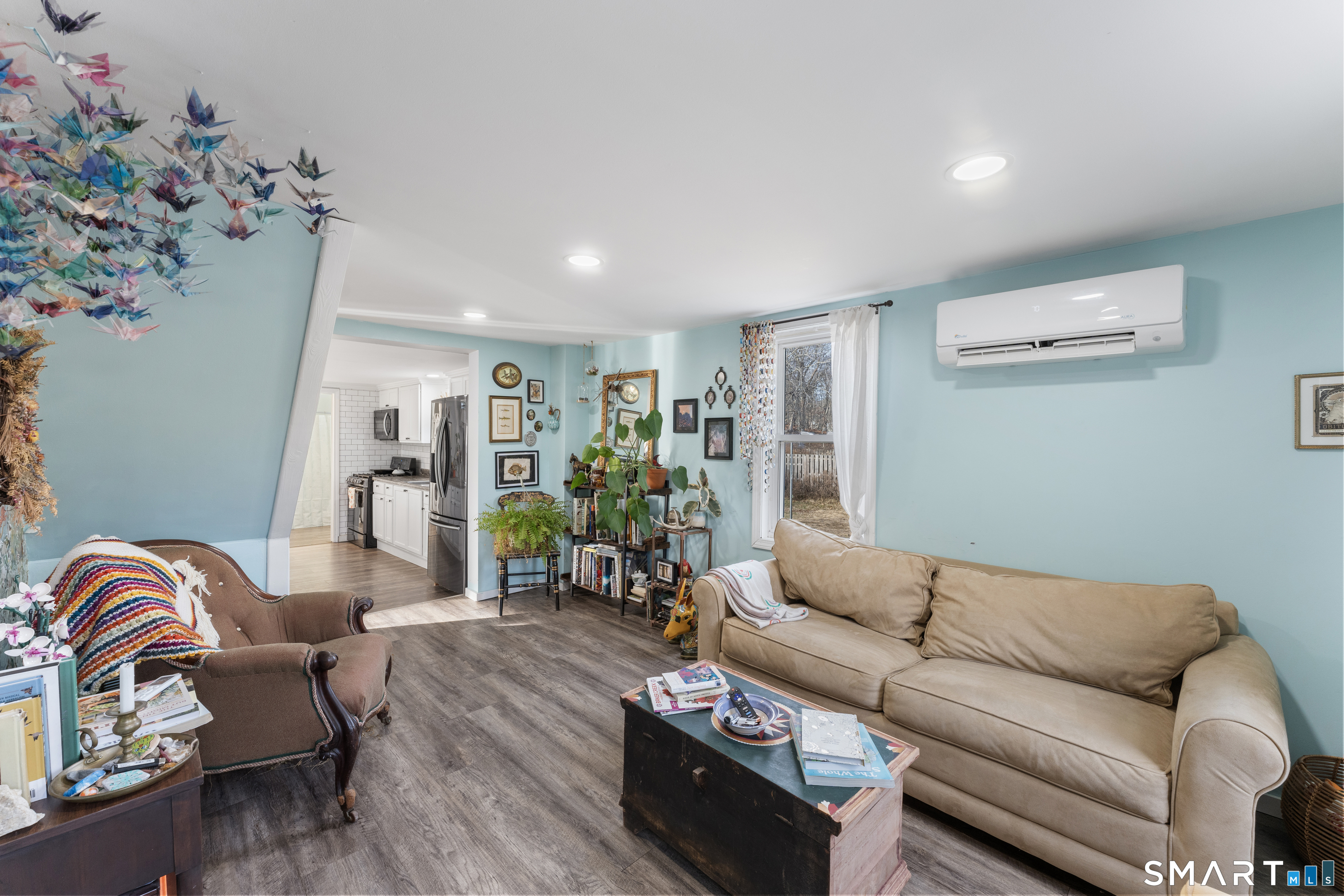 92 Hunters Avenue Norwich, CT 06380 - Photo 18 of 36 a living room with furniture flowerpot and wooden floor