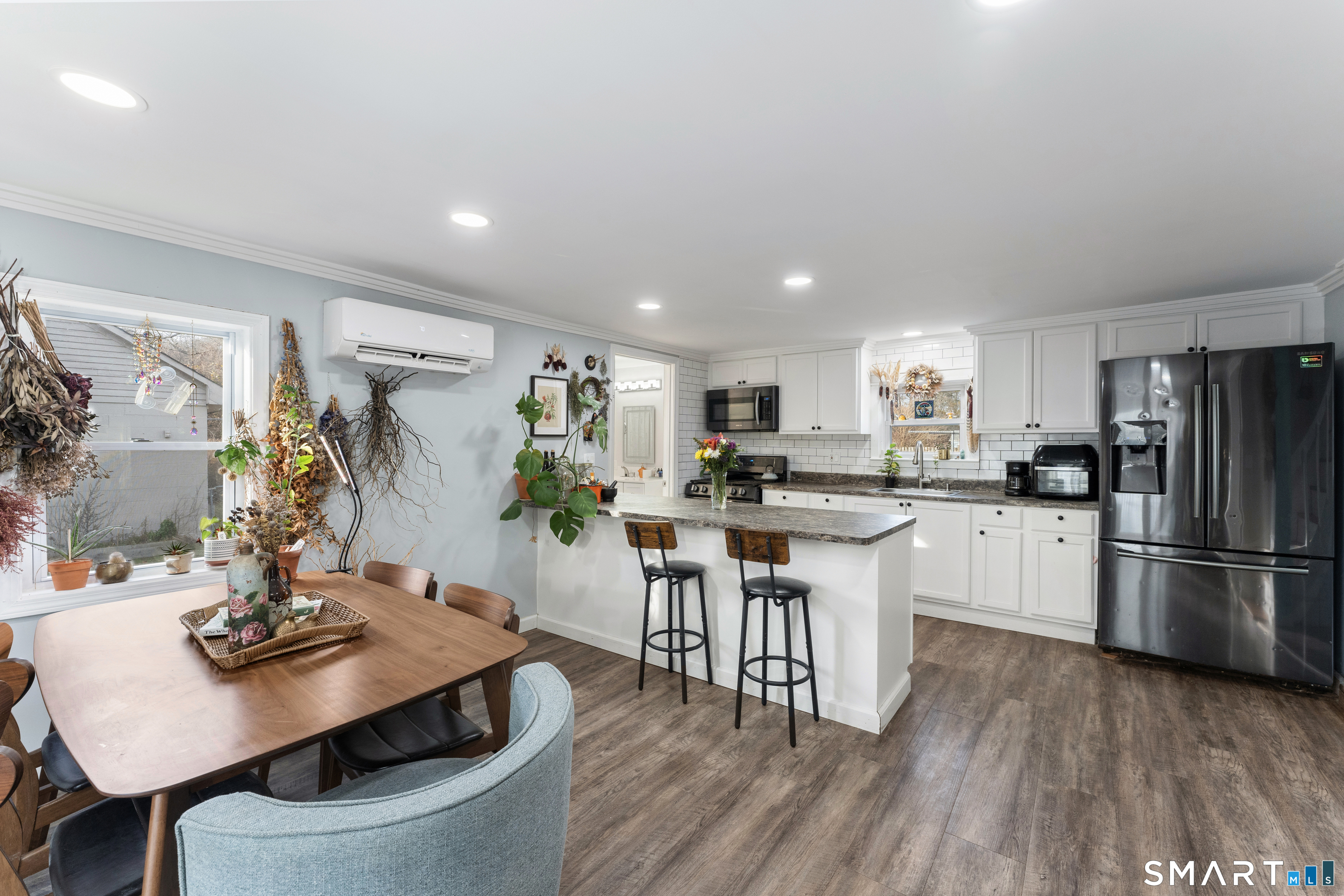 92 Hunters Avenue Norwich, CT 06380 - Photo 25 of 36 a kitchen with white cabinets and stainless steel appliances