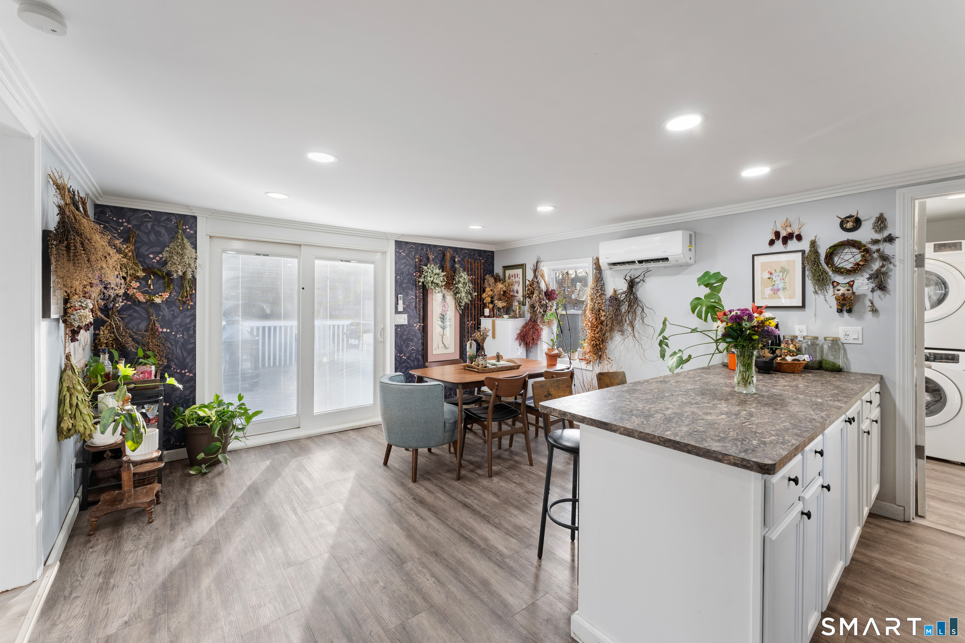 92 Hunters Avenue Norwich, CT 06380 - Photo 26 of 36 a view of a dining room with furniture window and wooden floor