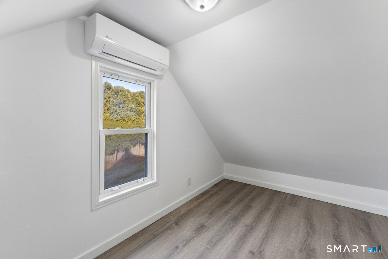 92 Hunters Avenue Norwich, CT 06380 - Photo 33 of 36 a view of an empty room with a window