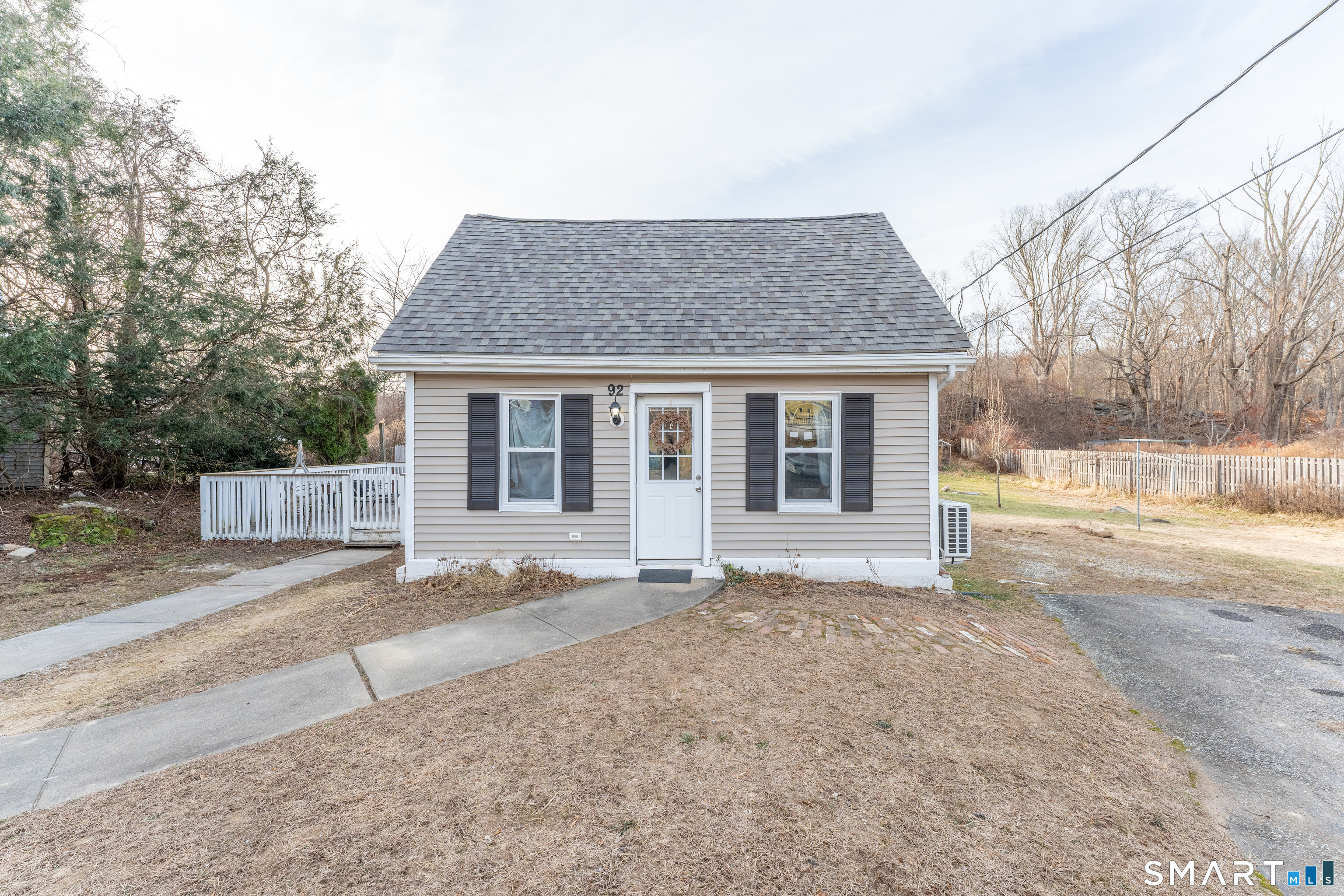 92 Hunters Avenue Norwich, CT 06380 - Photo 5 of 36 a view of a house with a yard and large tree
