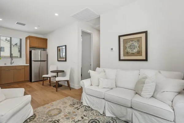 a living room with furniture and a rug