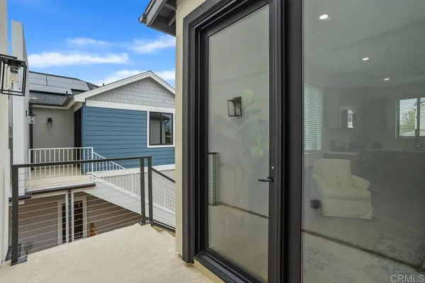 a bathroom with a glass shower door