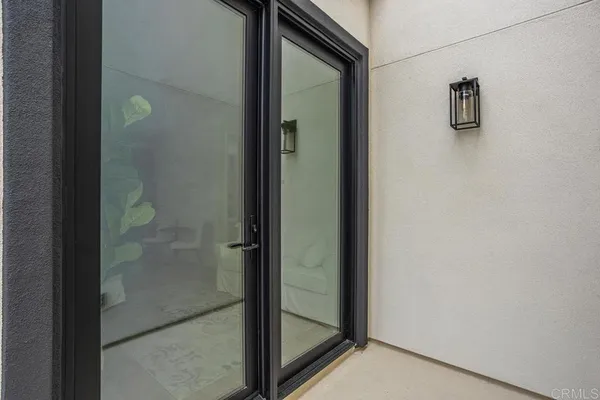 a view of entryway with wooden floor