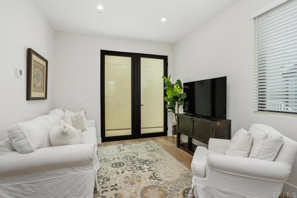 1756 Whaley Street Oceanside, CA 92054 - Photo 4 of 26 a living room with furniture and a flat screen tv