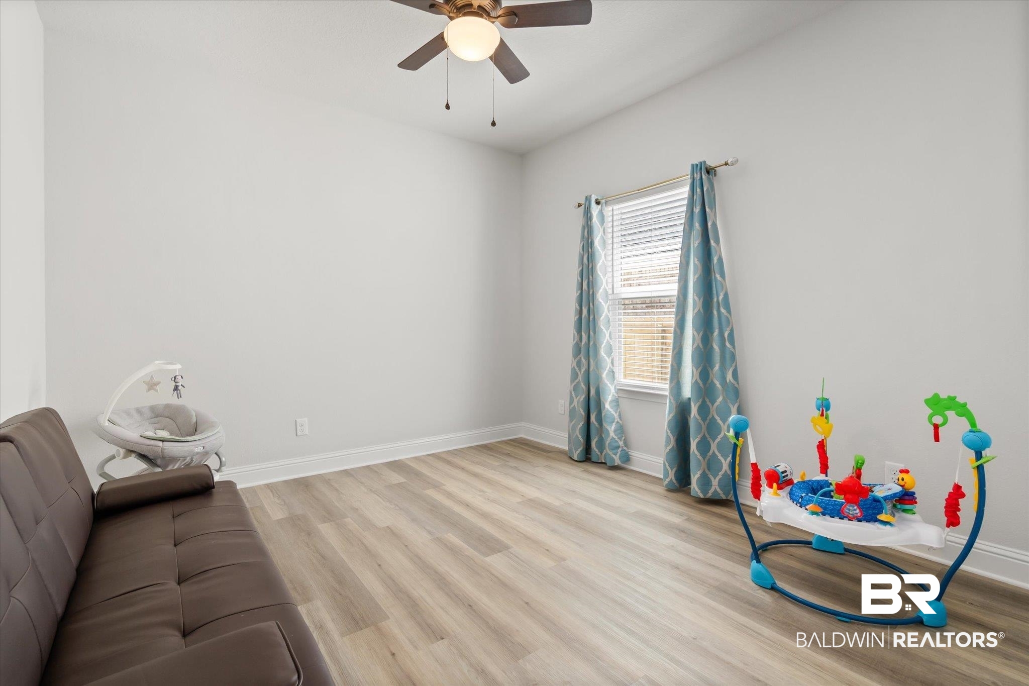 1167 Provision Road Mobile, AL 36608 - Photo 16 of 20 Interior space featuring a ceiling fan, baseboards, and wood finished floors