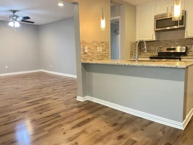 a view of cabinet with wooden floor