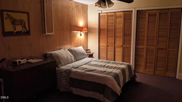a bedroom with a bed and cabinets