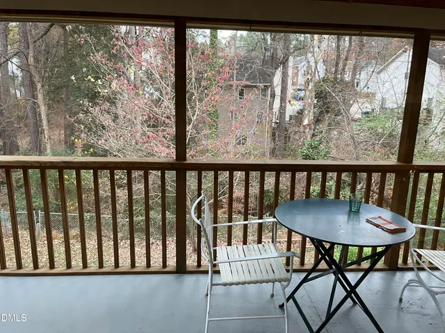 a view of a balcony with furniture