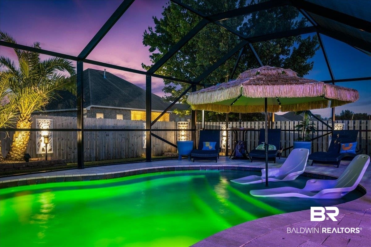 7022 Rocky Rd Loop Gulf Shores, AL 36542 - Photo 49 of 59 View of swimming pool featuring a fenced backyard, a patio area, and glass enclosure