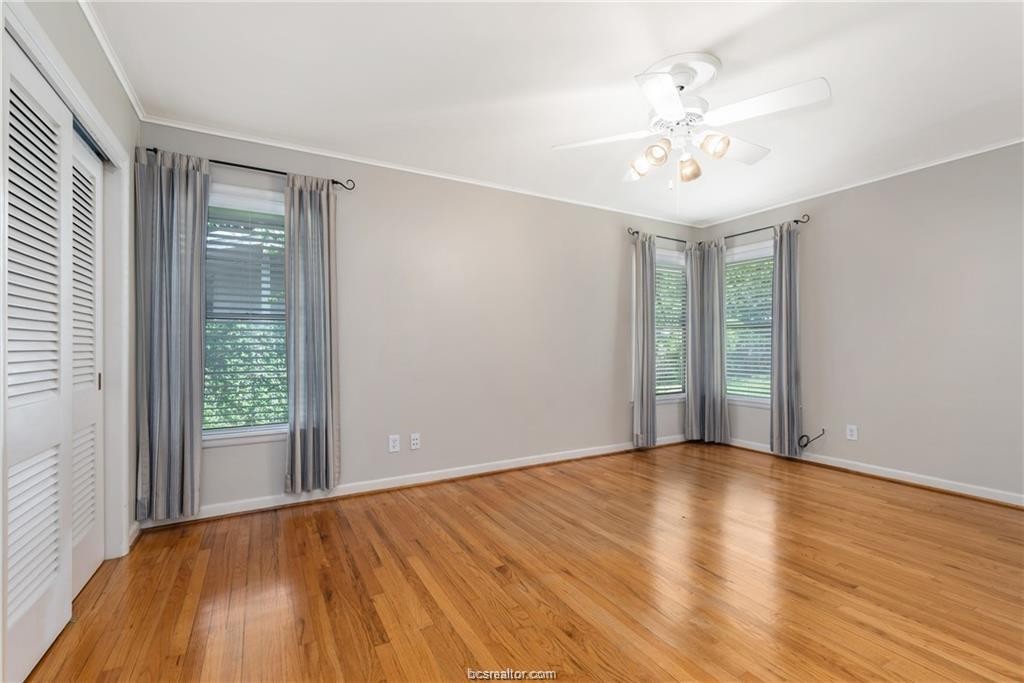 401 Helena Street Bryan, TX 77801 - Photo 15 of 21 a view of an empty room with wooden floor and a window