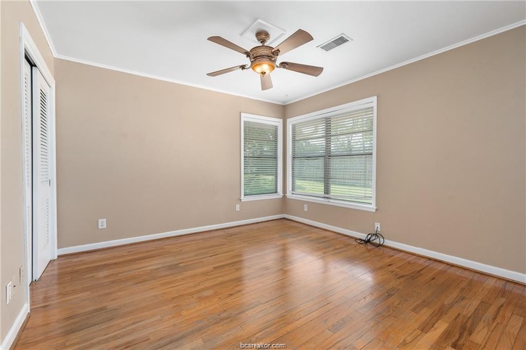 401 Helena Street Bryan, TX 77801 - Photo 16 of 21 a view of an empty room with wooden floor and a window