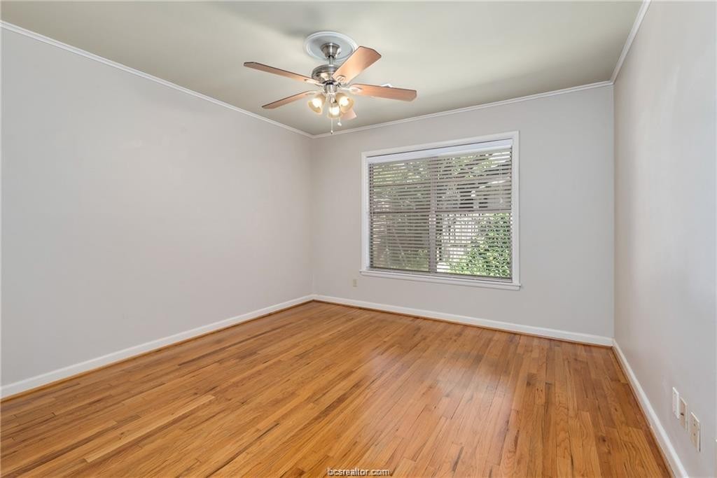 401 Helena Street Bryan, TX 77801 - Photo 17 of 21 a view of an empty room with wooden floor and a window