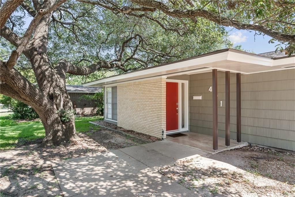 401 Helena Street Bryan, TX 77801 - Photo 3 of 21 a front view of a house with a yard