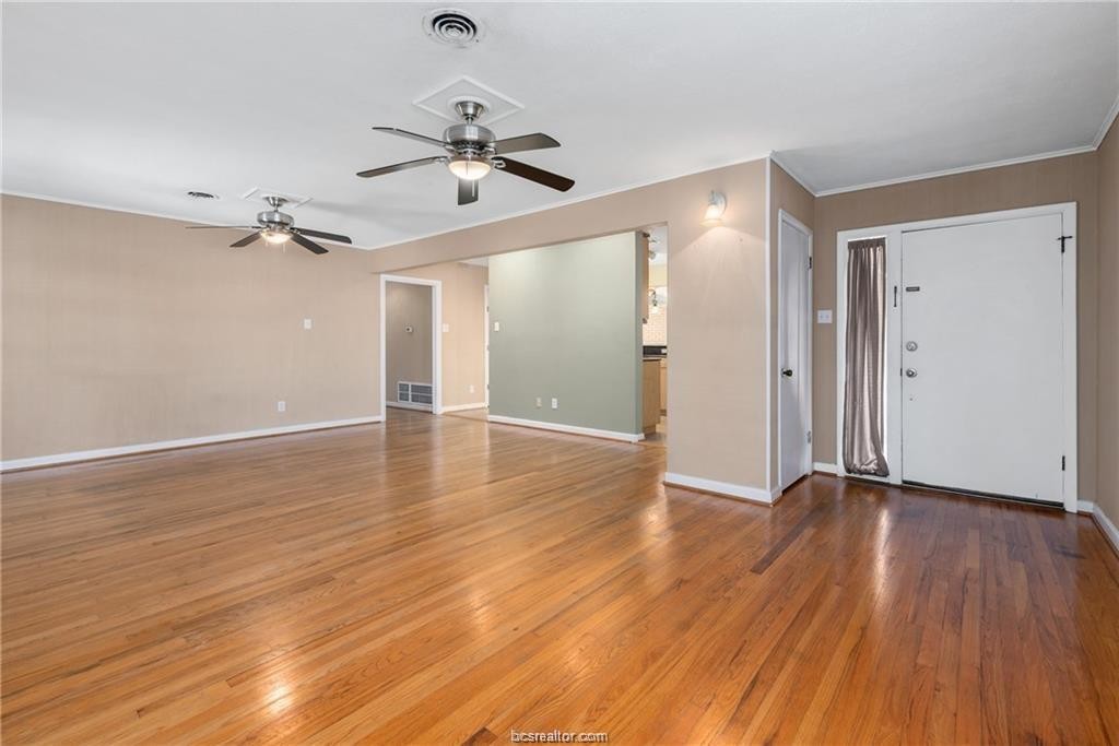 401 Helena Street Bryan, TX 77801 - Photo 4 of 21 a view of an empty room and wooden floor