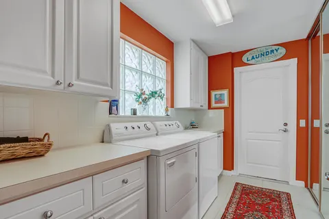 a utility room with closet dryer and washer