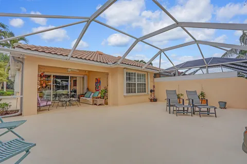 a view of a patio with table and chairs and potted plants