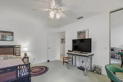 a view of a livingroom with furniture and a flat screen tv