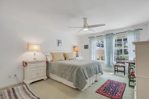 a bedroom with a bed furniture and a window