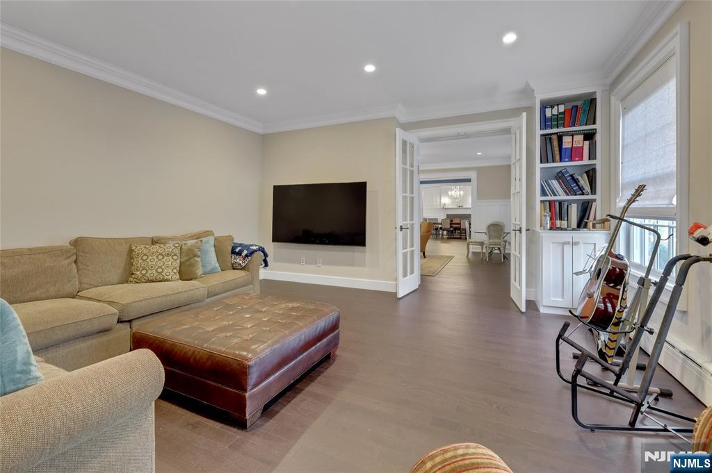 292 Maple Street Englewood, NJ 07631 - Photo 10 of 48 a living room with furniture and a flat screen tv