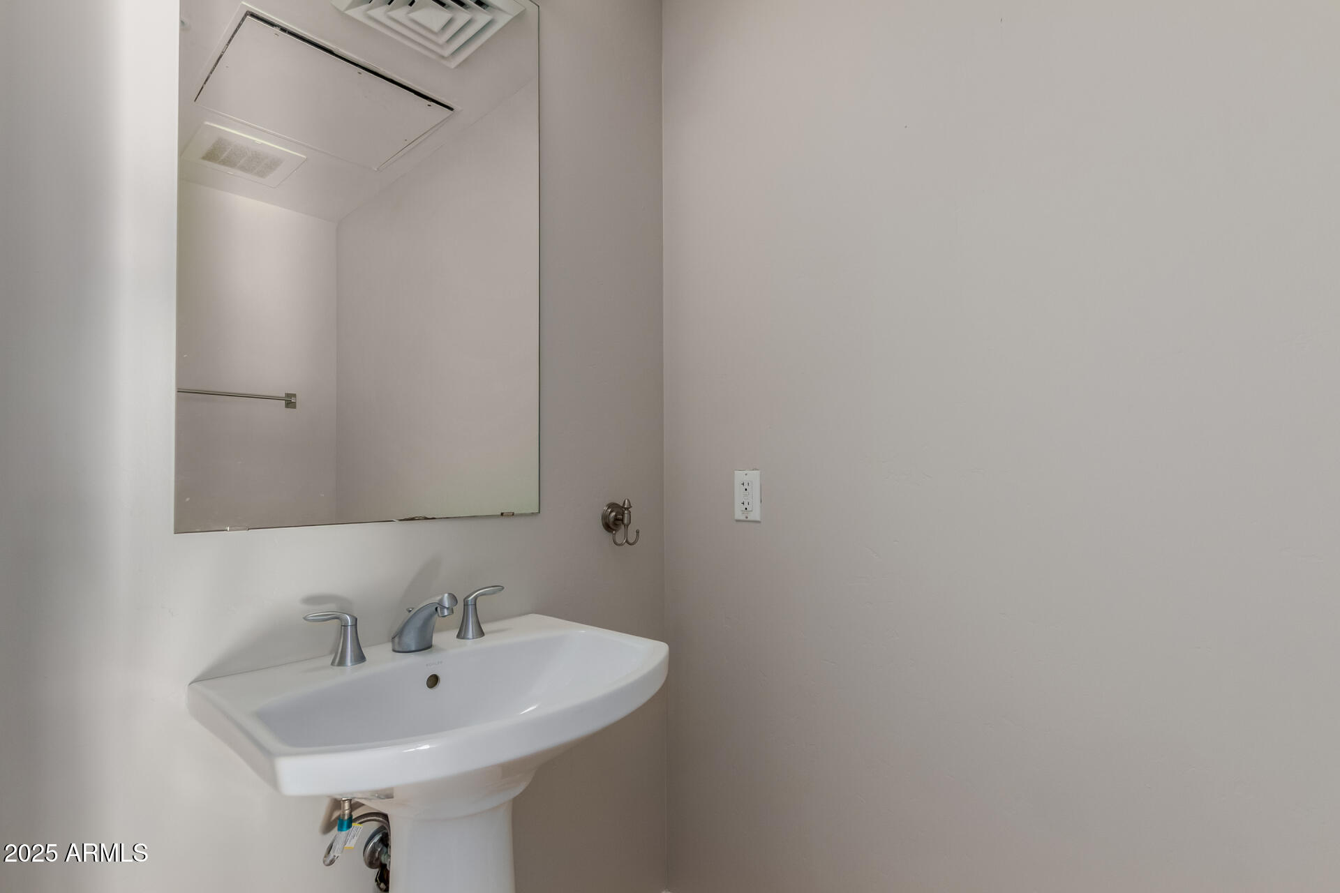 310 South 4th Street, Unit 1902 Phoenix, AZ 85004 - Photo 13 of 37 a bathroom with a sink and a mirror