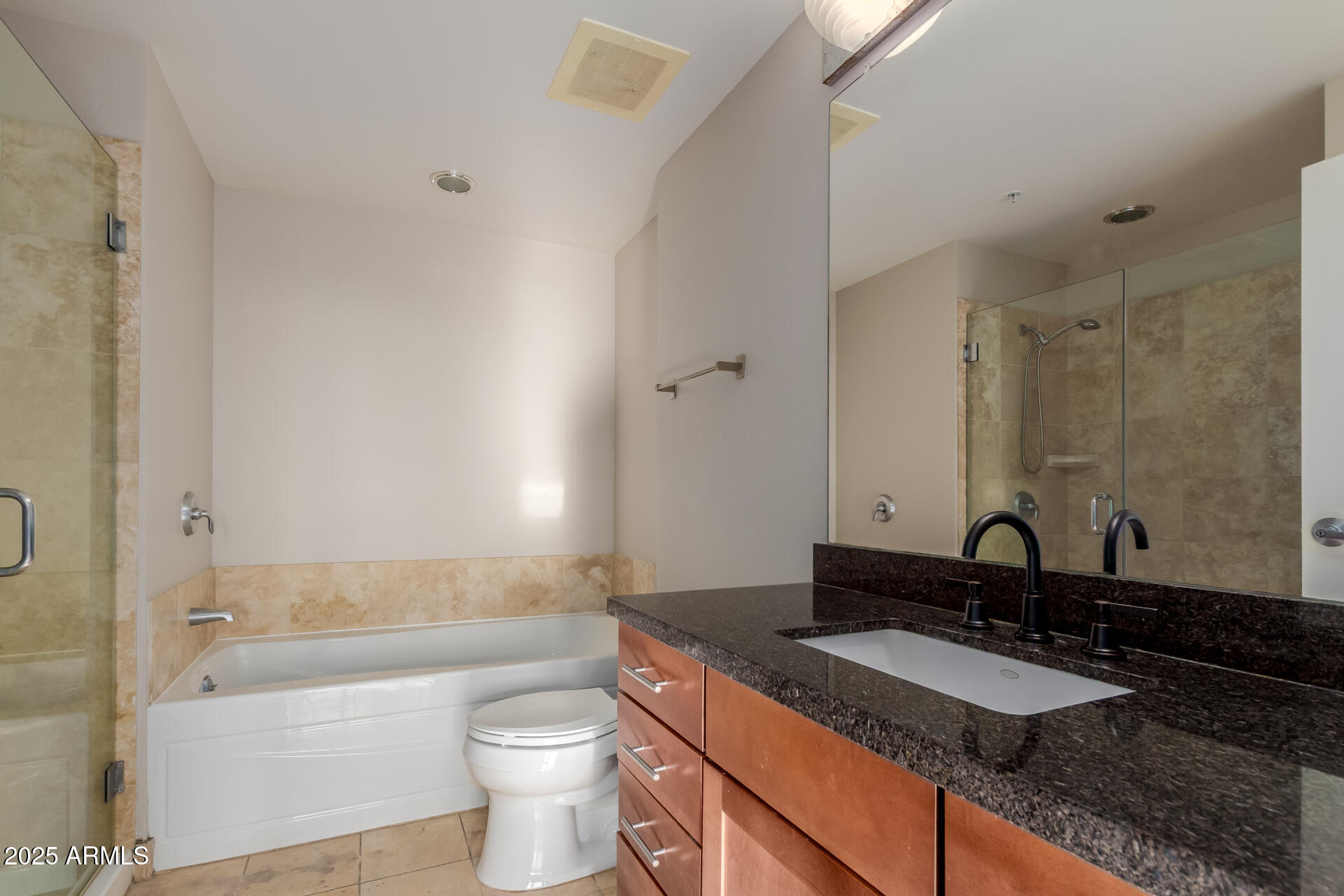 310 South 4th Street, Unit 1902 Phoenix, AZ 85004 - Photo 18 of 37 a bathroom with a granite countertop sink toilet and shower