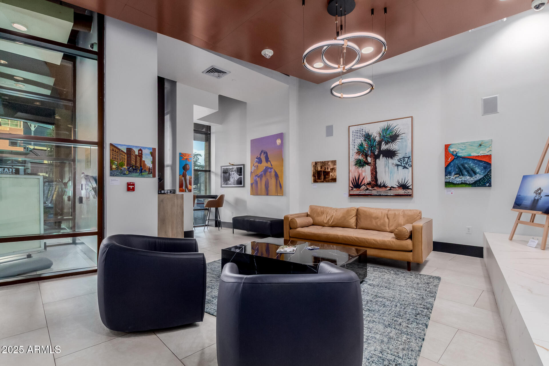 310 South 4th Street, Unit 1902 Phoenix, AZ 85004 - Photo 21 of 37 a living room with furniture and a chandelier