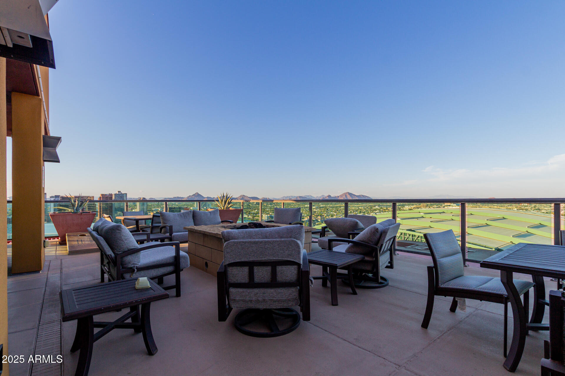 310 South 4th Street, Unit 1902 Phoenix, AZ 85004 - Photo 32 of 37 a balcony with outdoor seating and city view