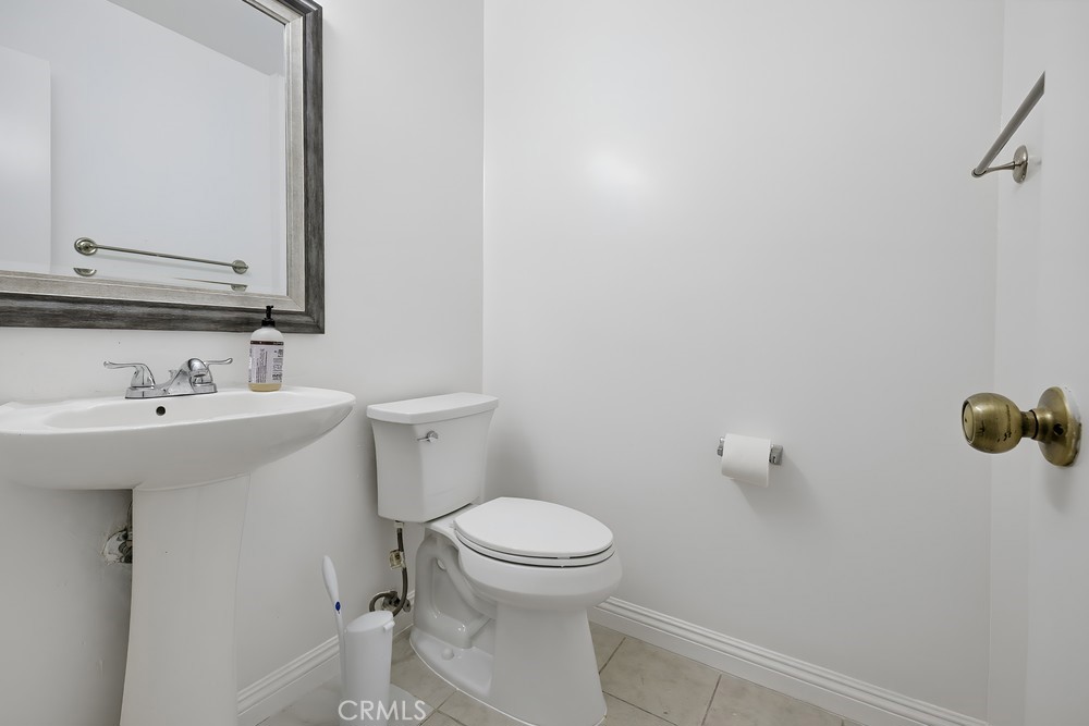 115 Remington Irvine, CA 92620 - Photo 12 of 25 a bathroom with a sink a toilet and a mirror
