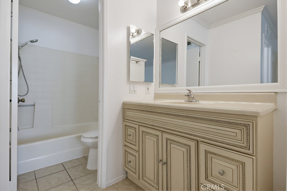 115 Remington Irvine, CA 92620 - Photo 15 of 25 a bathroom with a sink a toilet and shower
