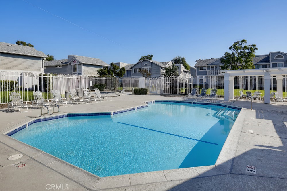 115 Remington Irvine, CA 92620 - Photo 24 of 25 a view of a swimming pool with outdoor seating