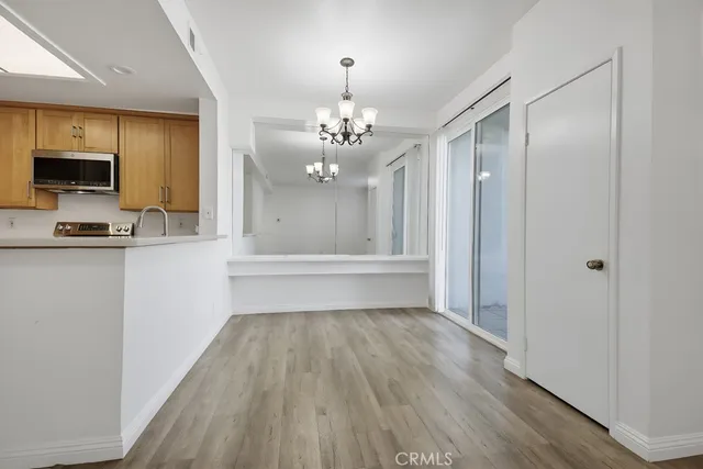 a bathroom with a sink a mirror a vanity and a shower